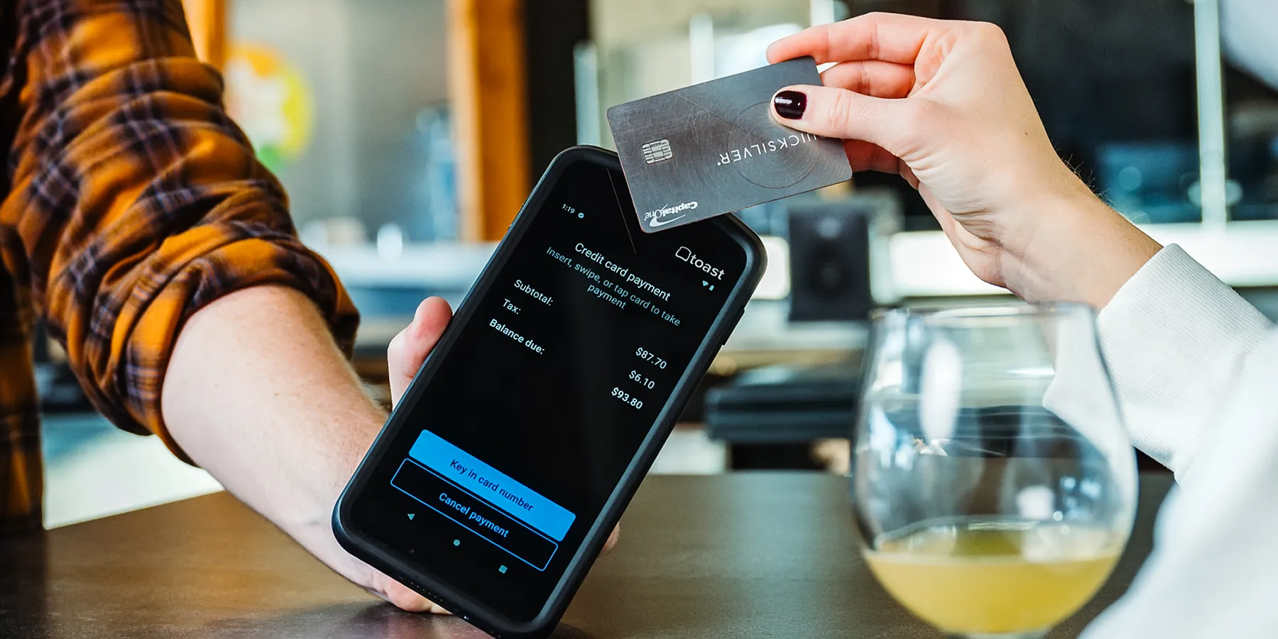 Toast Go 3 handheld processing a card payment
